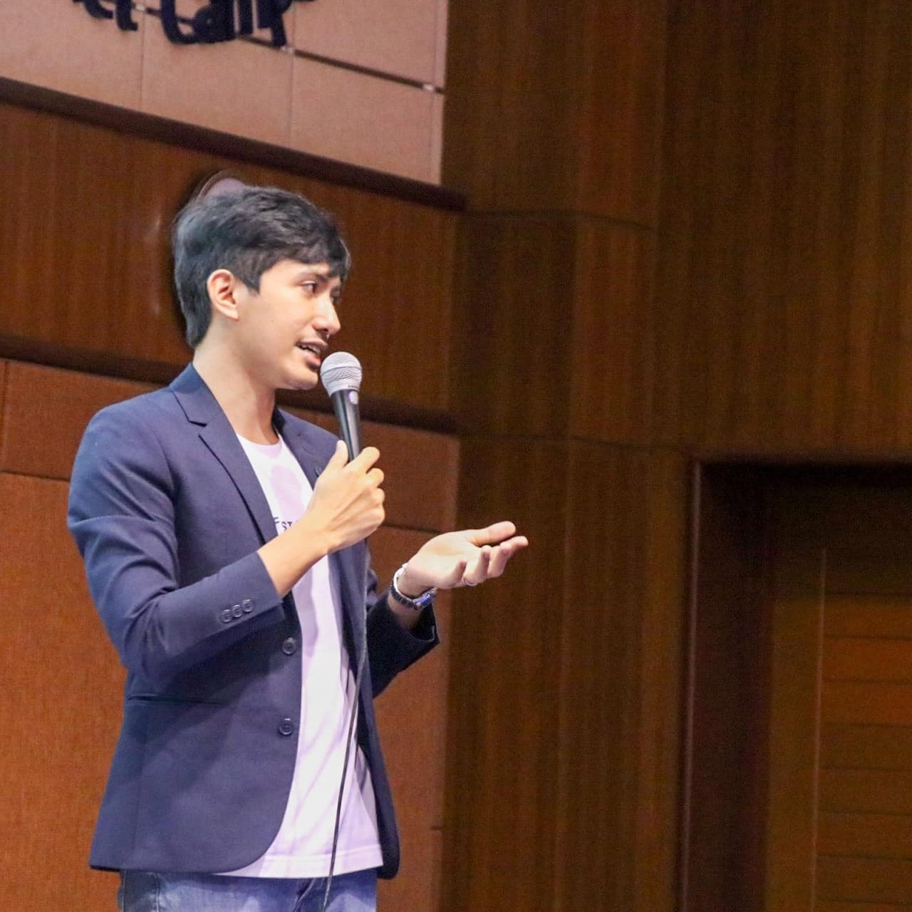Sainy speaking at an event